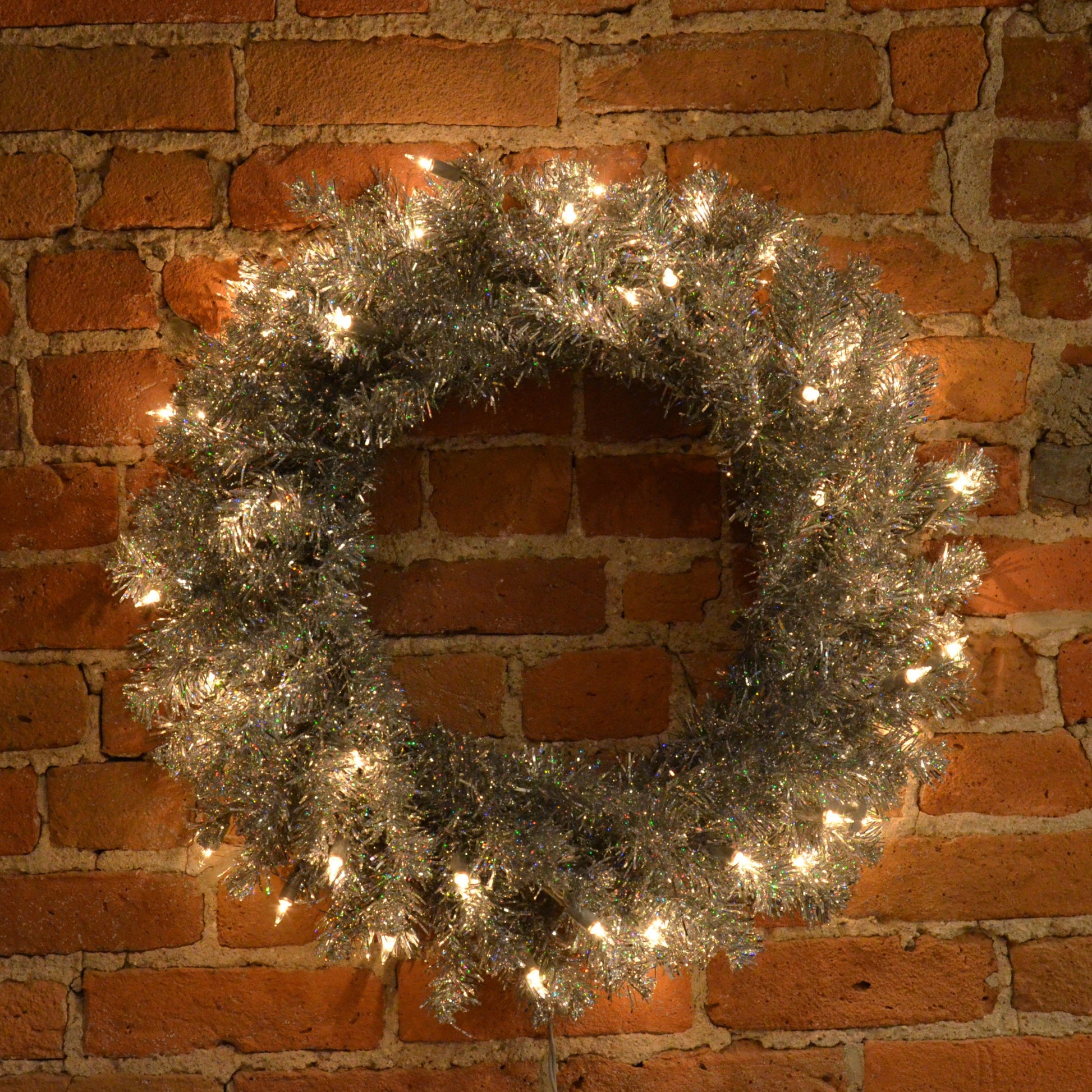 24“ Silver Artificial Christmas Wreath with 180 PVC Tips and 50 Warm White Dura-Lit Italian LED Mini Lights. Incorporate bright and modern holiday décor into your space with this beautiful wreath